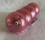 Light pink squidgy disco caterpillar. Sensory fidget toys