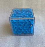 Cube Maze with small silver ball to slide around the puzzle