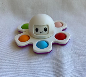 Fidget Spinner Octopus with happy face six soft dimples to press sensory toy